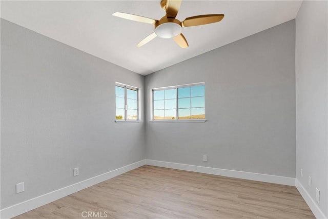 unfurnished room featuring vaulted ceiling, ceiling fan, and light wood-type flooring