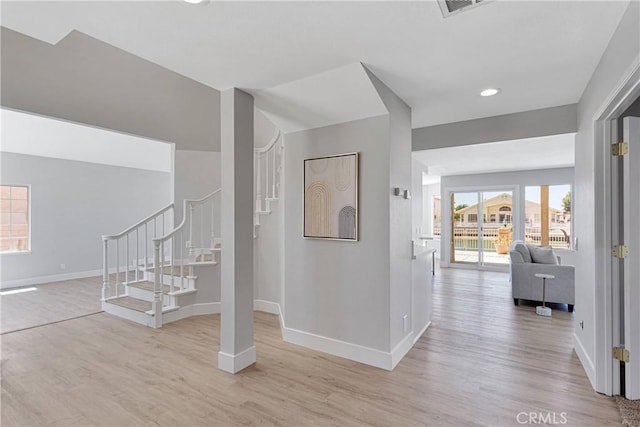 hall with light hardwood / wood-style flooring