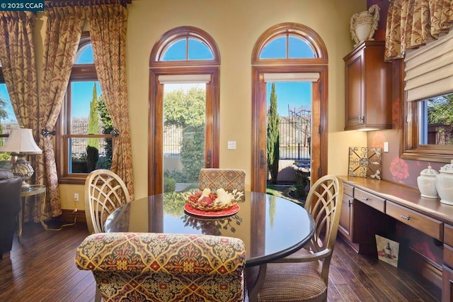 dining area featuring dark hardwood / wood-style flooring