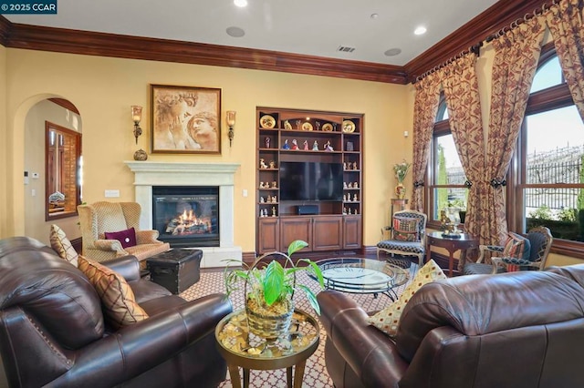 living room with ornamental molding