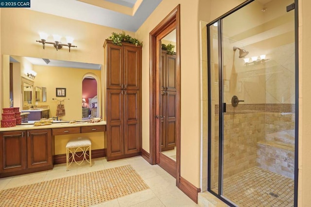 bathroom with vanity, tile patterned floors, and walk in shower