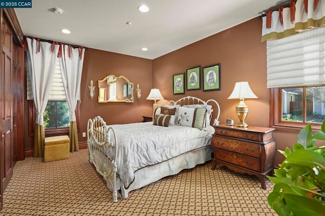 carpeted bedroom featuring a closet