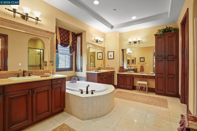 bathroom featuring independent shower and bath, tile patterned flooring, a tray ceiling, and vanity