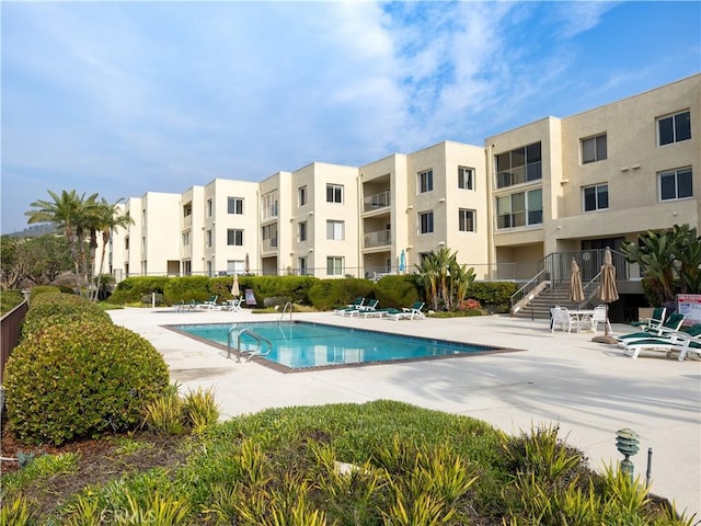 view of swimming pool with a patio area