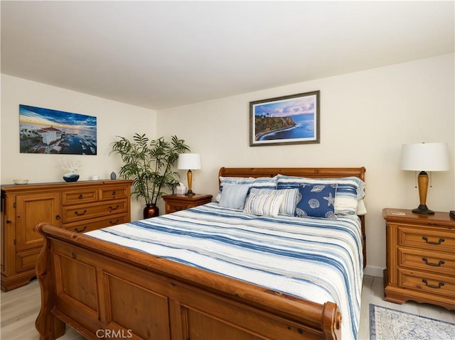 bedroom with light hardwood / wood-style flooring