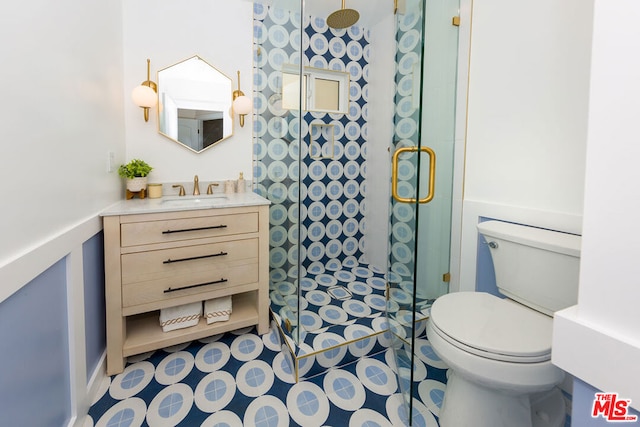 bathroom featuring toilet, vanity, tile patterned flooring, and walk in shower