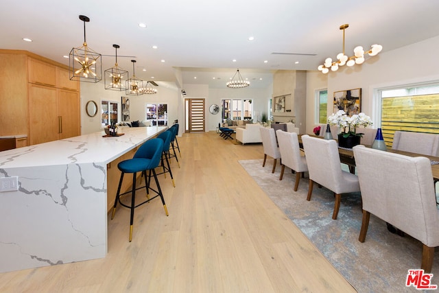 dining space featuring light wood-type flooring