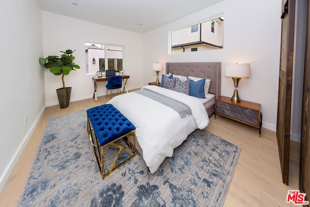 bedroom with light hardwood / wood-style floors