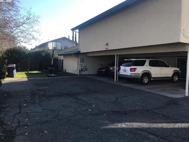 view of side of home with a carport