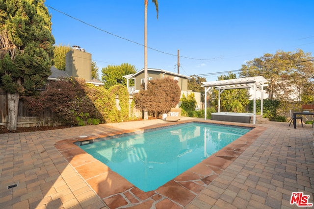 view of pool featuring a pergola, a patio area, and a hot tub