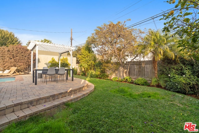 view of yard with a pergola and a patio