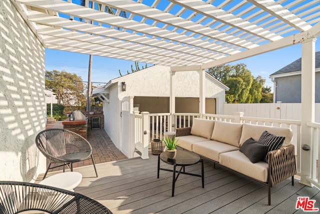 deck featuring an outdoor kitchen and an outdoor hangout area