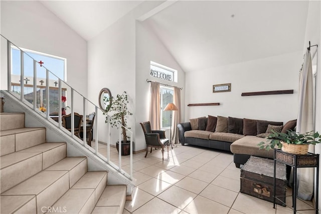 tiled living room featuring high vaulted ceiling