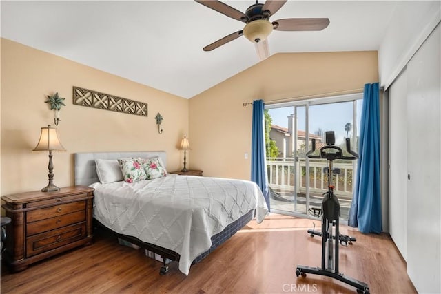 bedroom featuring wood-type flooring, access to exterior, a closet, vaulted ceiling, and ceiling fan