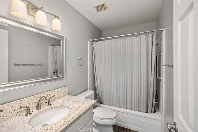 full bathroom featuring toilet, vanity, and shower / bath combination with curtain