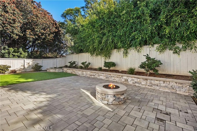 view of patio / terrace featuring a fire pit