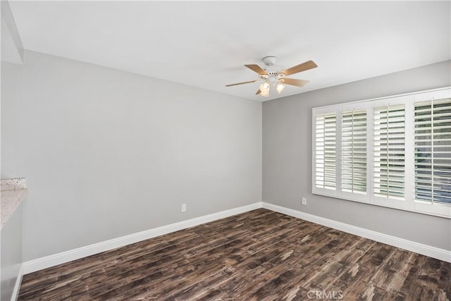 unfurnished room featuring ceiling fan and dark hardwood / wood-style flooring