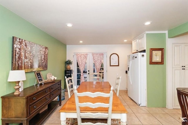 dining room with french doors and light tile patterned flooring