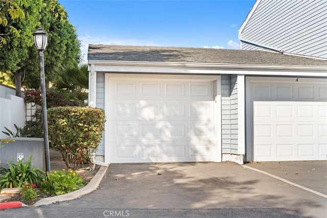 garage featuring driveway