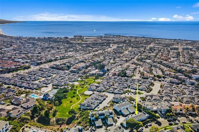 drone / aerial view featuring a residential view and a water view