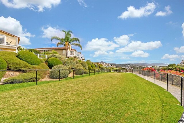 exterior space with a yard and fence