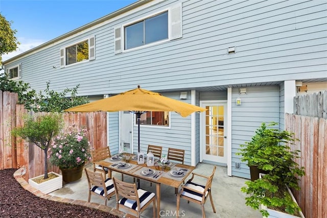 view of patio / terrace with outdoor dining space and a fenced backyard