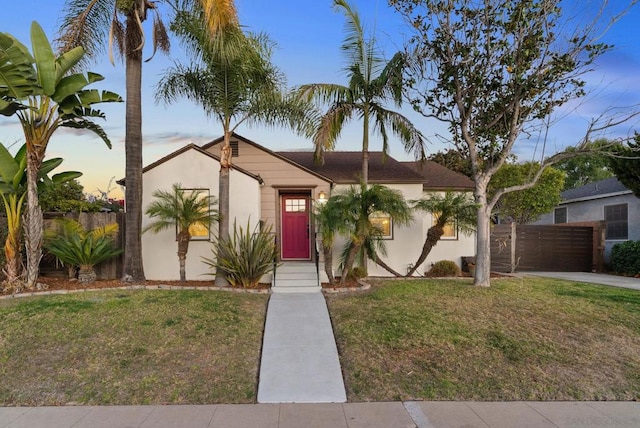 view of front of house with a lawn