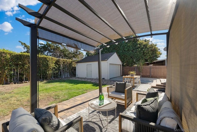 view of patio with a garage, outdoor lounge area, and an outdoor structure