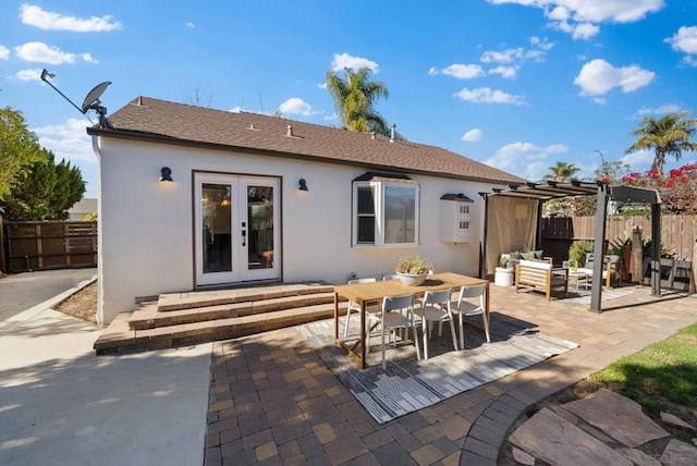 rear view of house featuring french doors and a patio area