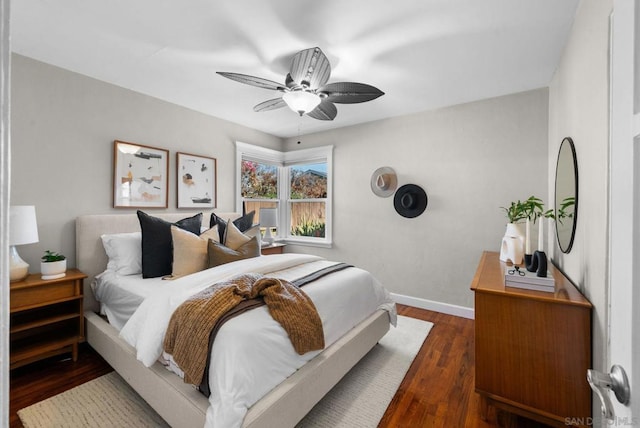 bedroom featuring ceiling fan and dark hardwood / wood-style floors