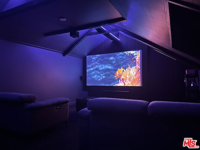 home theater room featuring lofted ceiling with beams and wood ceiling