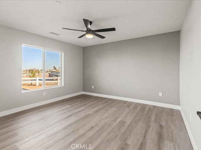 unfurnished room featuring ceiling fan and light hardwood / wood-style flooring