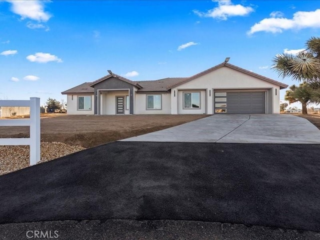 single story home featuring a garage