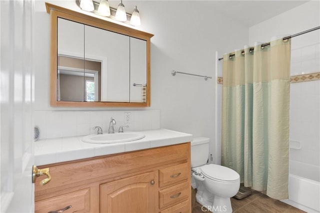 full bathroom featuring toilet, vanity, tasteful backsplash, tile patterned floors, and shower / bath combination with curtain