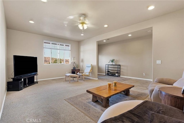 carpeted living room featuring ceiling fan