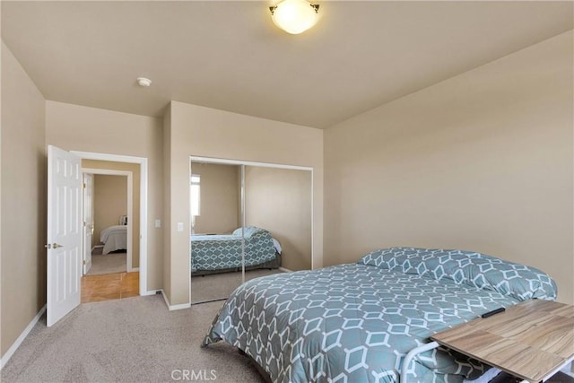 carpeted bedroom with a closet