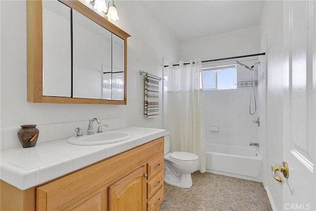 full bathroom featuring toilet, vanity, and shower / tub combo