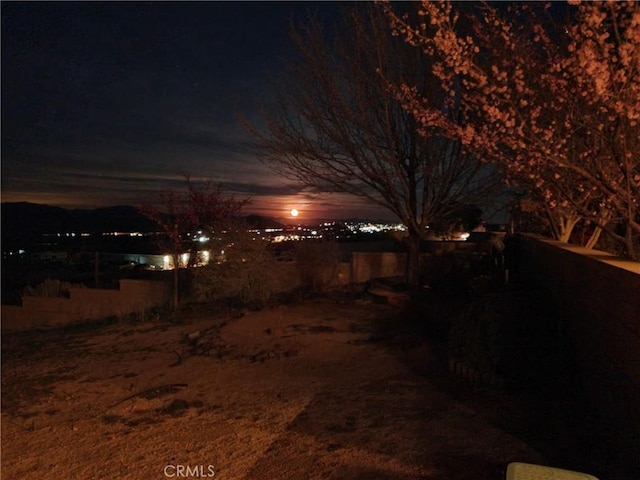 yard at night with a mountain view