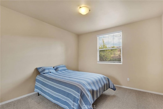 bedroom with light colored carpet