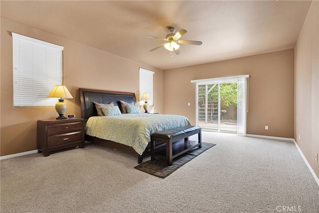 carpeted bedroom with ceiling fan and access to exterior