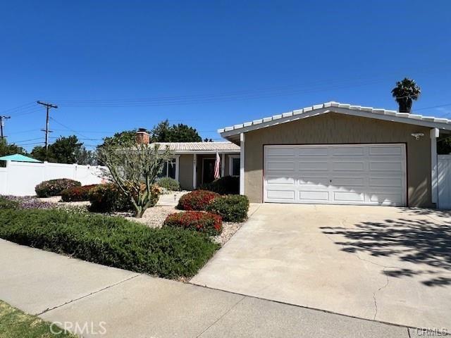 ranch-style house featuring a garage