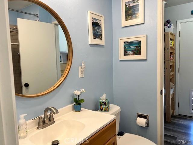 bathroom featuring toilet and vanity