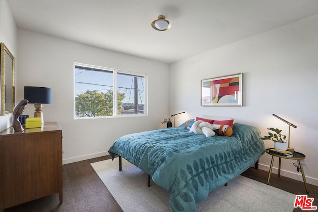 bedroom featuring dark wood-type flooring