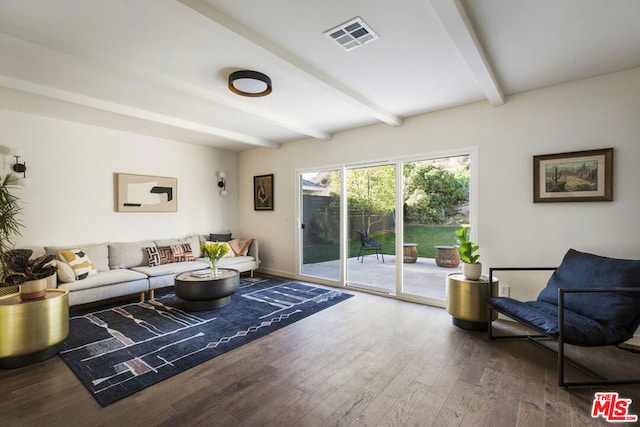 living room with beam ceiling and hardwood / wood-style floors