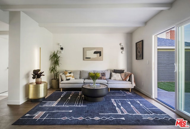 living room with beam ceiling and dark hardwood / wood-style flooring