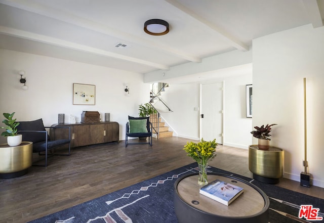 interior space with dark hardwood / wood-style floors and beamed ceiling