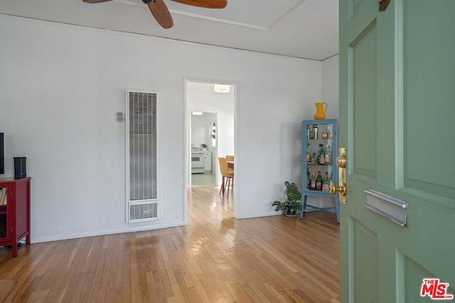 interior space with ceiling fan and light hardwood / wood-style floors