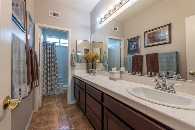 full bathroom featuring toilet, vanity, and shower / tub combo with curtain