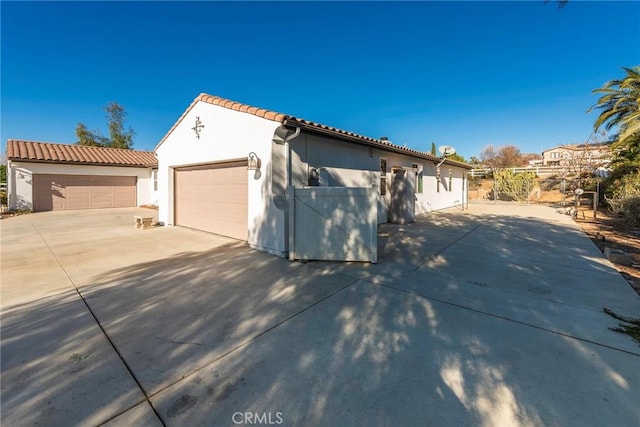 view of front of home with an outbuilding and a garage