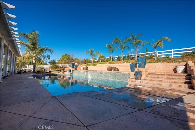 view of swimming pool with a patio